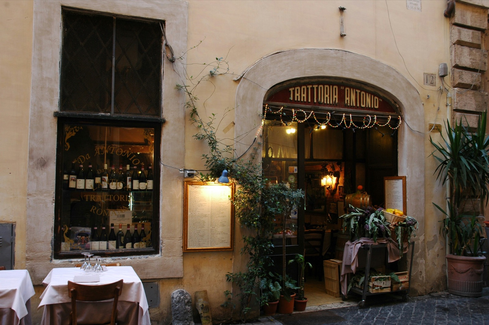 A menu framed beside the door, short enough to read standing up.